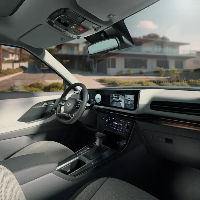 Interior do Novo CRETA Ultimate, destacando o banco do motorista, console central e painel integrado de 10,25”.